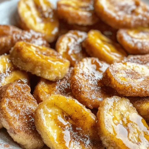 Fried bananas with cinnamon butter sauce is a delightful dish that combines the natural sweetness of ripe bananas with a rich, buttery sauce laced with fragrant cinnamon. This indulgent treat is not just a snack; it can double as a dessert that impresses family and friends alike. Whether served warm on its own or paired with a scoop of vanilla ice cream, this dish offers a sweet escape into comforting flavors.